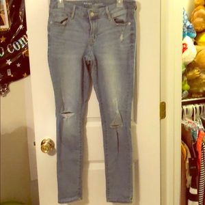 Distressed denim jeans